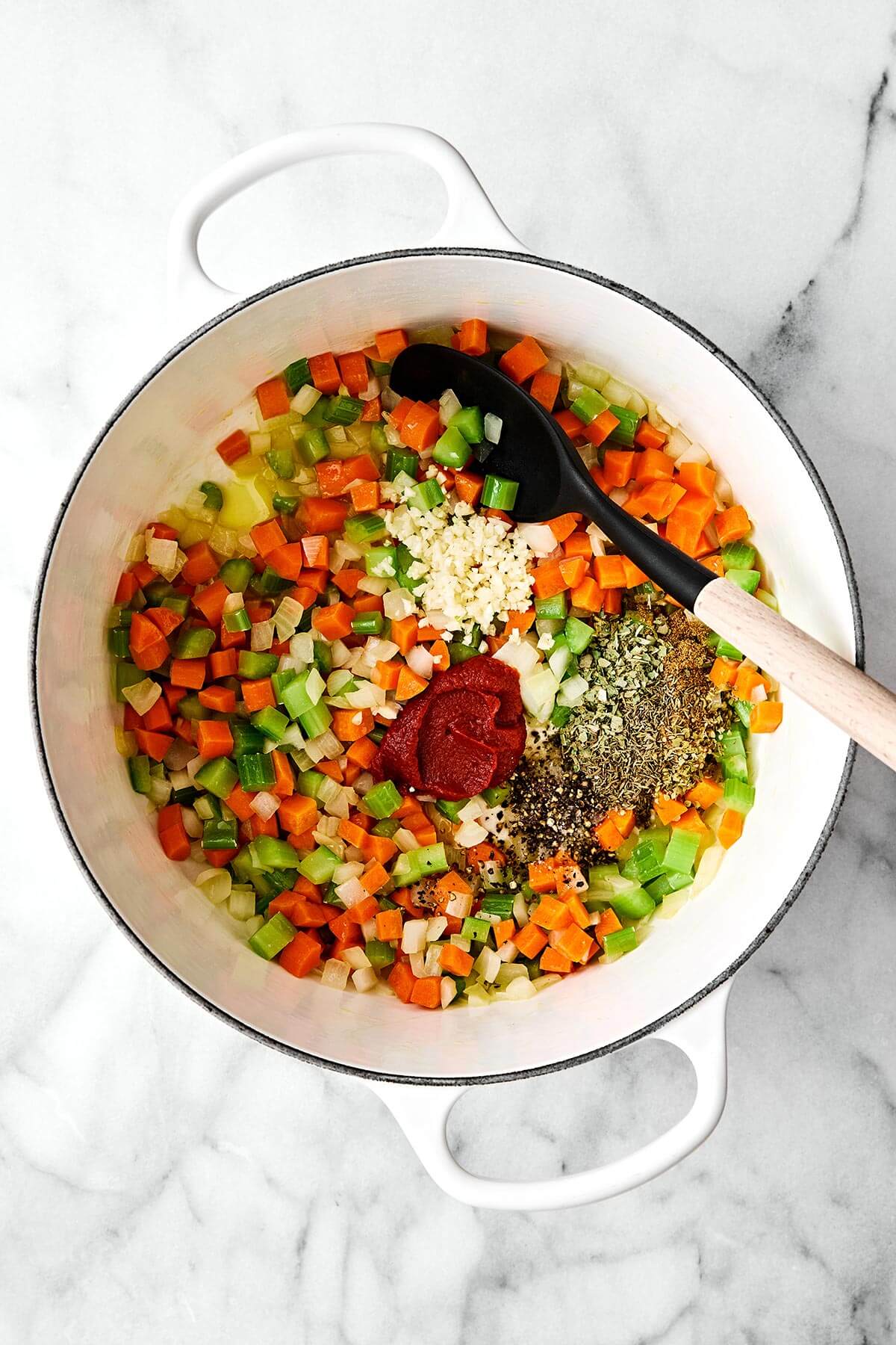Lentil soup is the perfect vegetarian meal to cozy up with for fall and winter. It’s hearty, healthy, and wonderfully filling thanks to its plant-based protein. And while there are many variations of lentil soup, this simple and vibrant Mediterranean version is extra special. Cooking vegetables and spices in a pot.