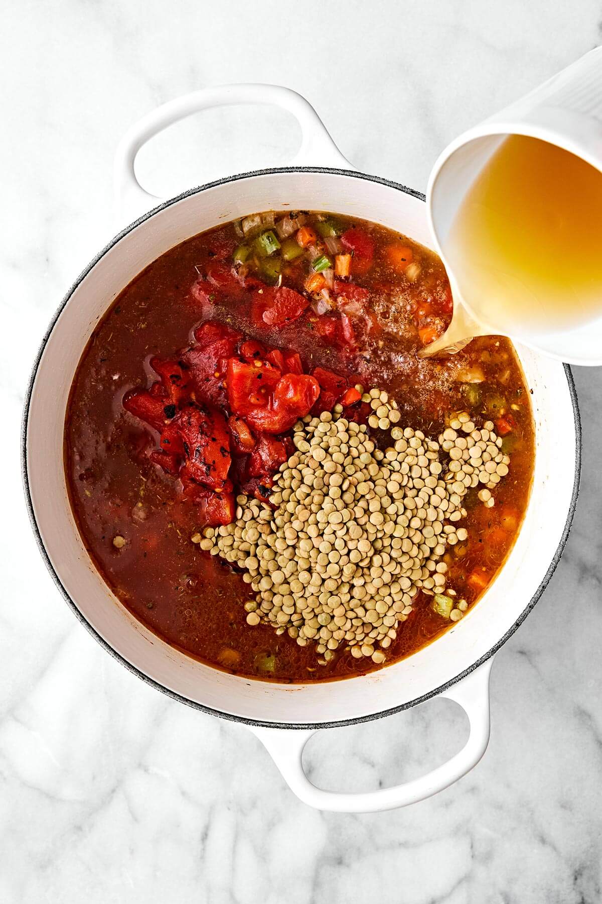 Lentil soup is the perfect vegetarian meal to cozy up with for fall and winter. It’s hearty, healthy, and wonderfully filling thanks to its plant-based protein. And while there are many variations of lentil soup, this simple and vibrant Mediterranean version is extra special. Simmering vegetables and broth in a pot.