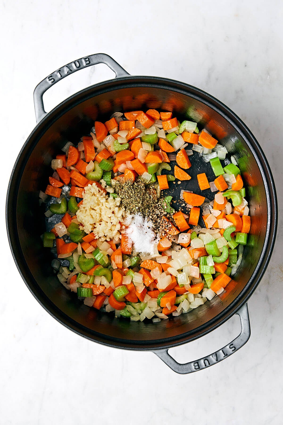 This easy vegetable soup recipe is packed with flavor and healthy vegetables, and is perfect for fall and winter soup season! Sauteing vegetables in a pot