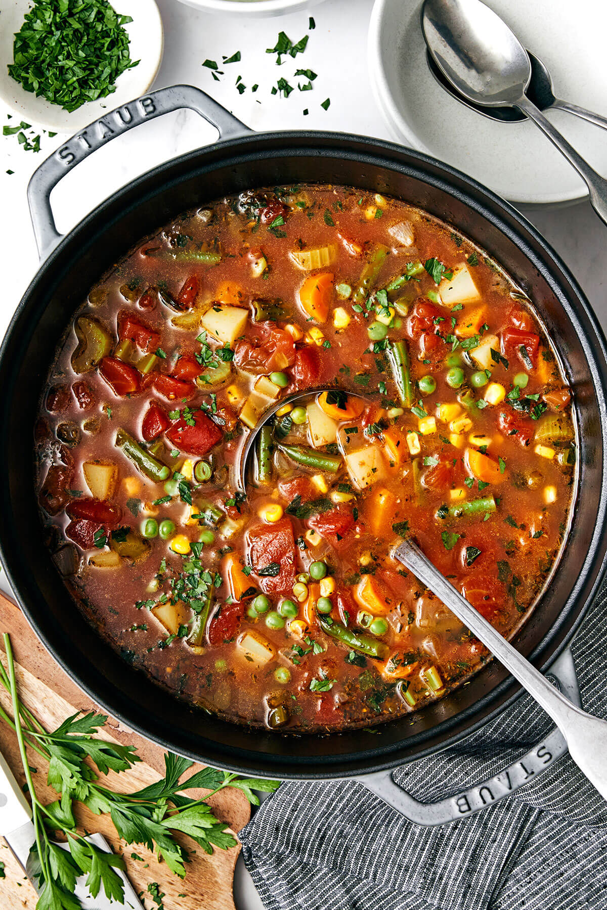 This easy vegetable soup recipe is packed with flavor and healthy vegetables, and is perfect for fall and winter soup season! A big pot of vegetable soup